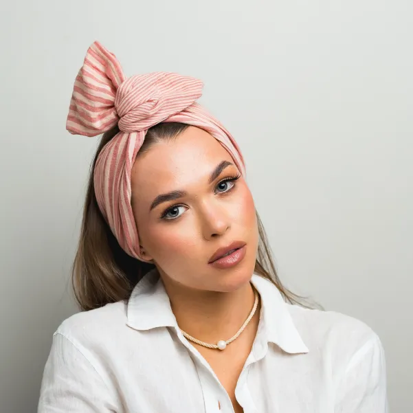 Bawełniana opaska twistband w różowe paseczki.