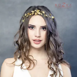 Złota wiązana opaska ślubna do welonu w romantycznym stylu.